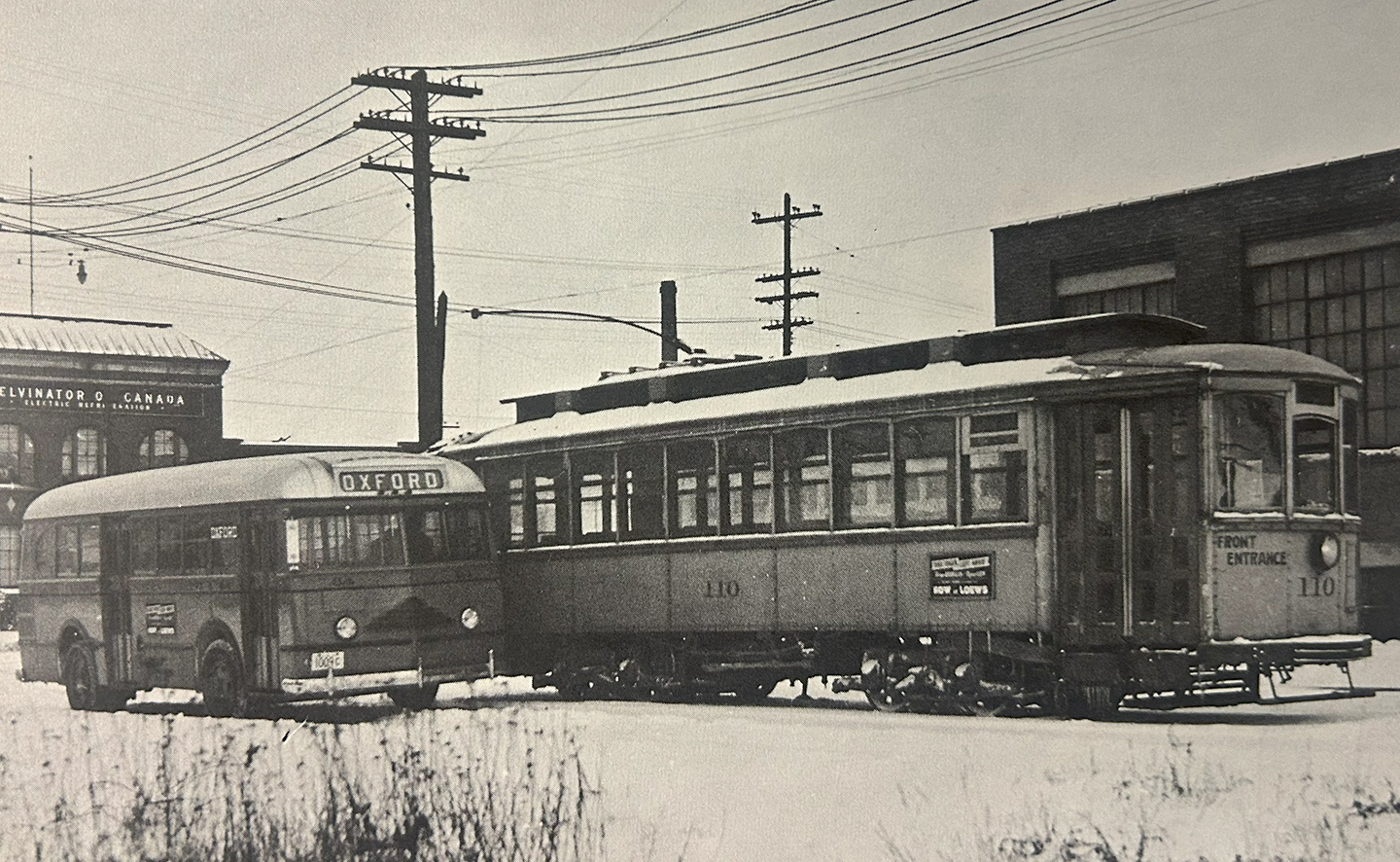 Side by side photo of a streetcar and Oxford Street bus from when the streetcars were all replaced by buses on the road.